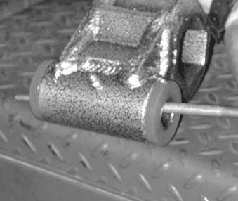 Filing burrs from the ends of the control arm sleeve