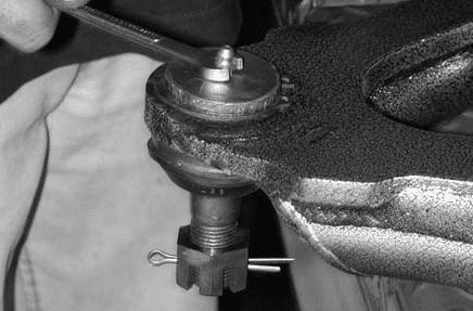 Inserting the greased inner sleeve into the control arm