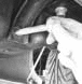 Removing shackle bolt from leaf spring mount
