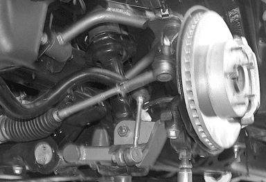Pressing factory ball joint into new lower arm (Fig #6)