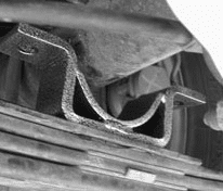 Reinstalling leaf spring under the axle with new locator bracket