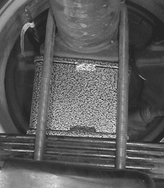 Lowering block with pinion shim secured with u-bolts (Fig #2)