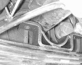 Relocated rear axle with new axle locator bracket on top of the leaf spring