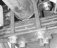 Removing the factory carrier bearing bracket from the cross member