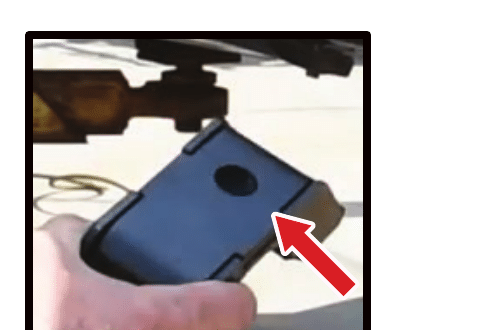 Technician checking bracket orientation