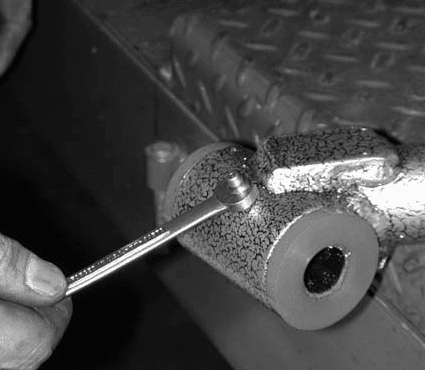 Wrench installing a grease fitting on the lower control arm pivot